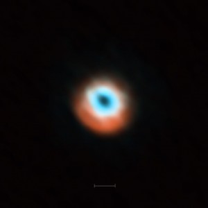 This ALMA image combines a view of the dust around the young star HD 135344B (orange) with a view of the gaseous material (blue). The smaller hole in the inner gas is a telltale sign of the presence of a young planet clearing the disc. The bar at the bottom of the image indicates the diameter of the orbit of Neptune in the Solar System (60 AU).
