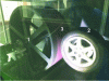Figure 11 - Photo of tire wear simulator, comprising: rotating drum (1), test tire (2) and abrasive surface (3) (after [30])