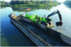 Figure 26 - Dredging shovel and dredged sediment storage barge (Credit VNF)