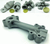 Figure 37 - Top: Various components of miniaturized mechanical systems – 316L or 17-4PH stainless steel. Bottom: Hydraulic block – 17-4PH stainless steel (source: CETIM – Liebherr)