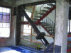 Figure 40 - Installation of a viscous fluid seismic damper in an existing concrete-frame structure (Photo DR)