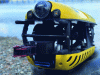 Figure 4 - The Tortuga 500 observation ROV from French company Subsea Tech. This robot can work at depths of up to 500 m, and features four steerable longitudinal thrusters (17 kgf per thruster) and two vertical thrusters (10 kgf per thruster). The orientation of the thrusters makes it possible to optimize thrust to suit the application, and to work in strong sea currents (up to 4 knots) (credit: Subsea Tech).
