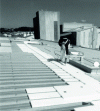 Figure 9 - Installation of expanded polystyrene insulation on steel roofing (Doc. Renovtoit by KNAUF)